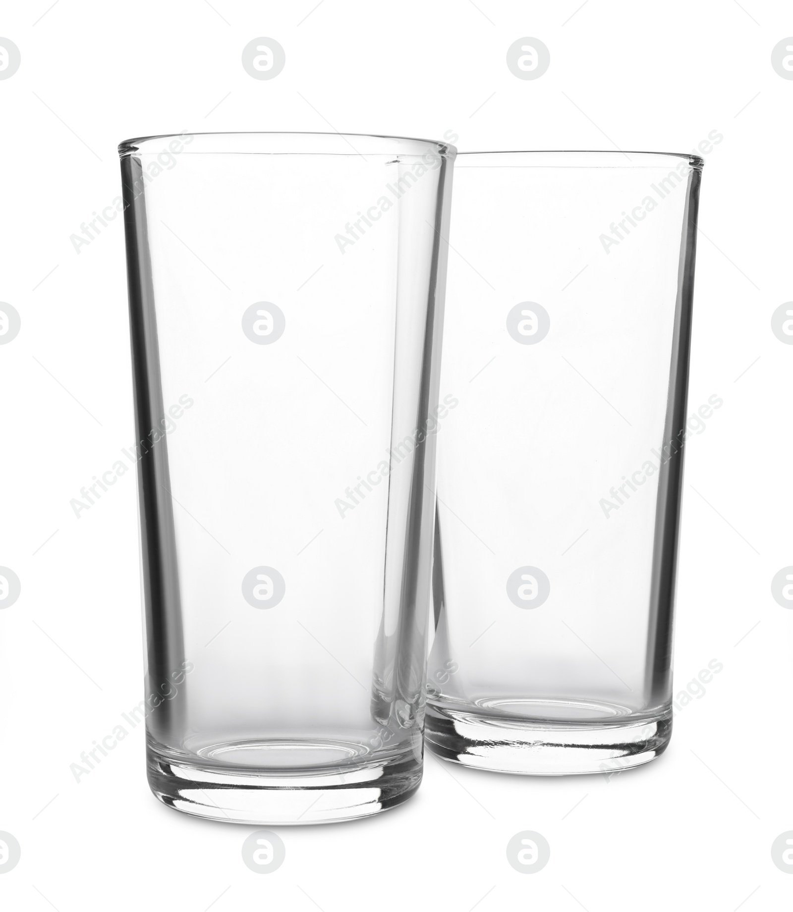 Photo of New clean empty glasses on white background