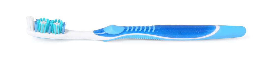 Photo of One blue plastic toothbrush isolated on white