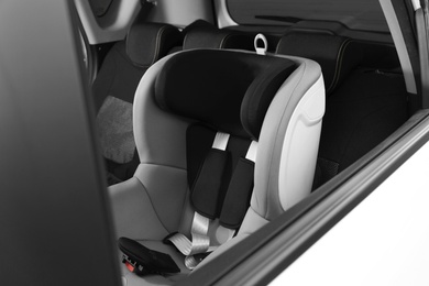 Photo of Empty baby seat inside car. Child safety