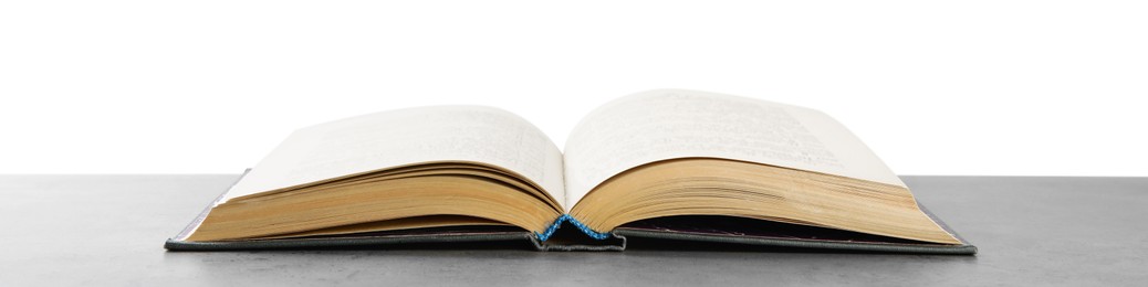 Photo of Open old hardcover book on grey table