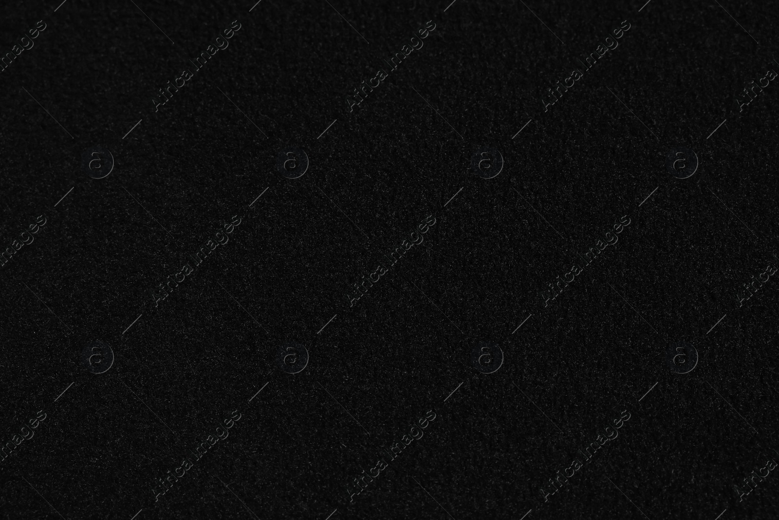 Photo of Texture of black car floor carpet as background, top view