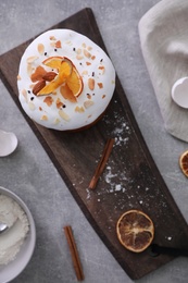 Decorated Easter cake on light grey table, flat lay