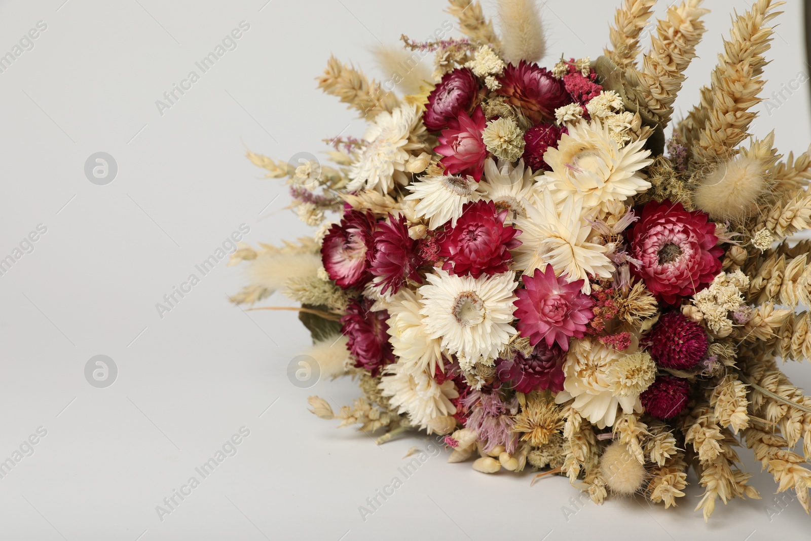 Photo of Beautiful bouquet of dry flowers on white background, space for text