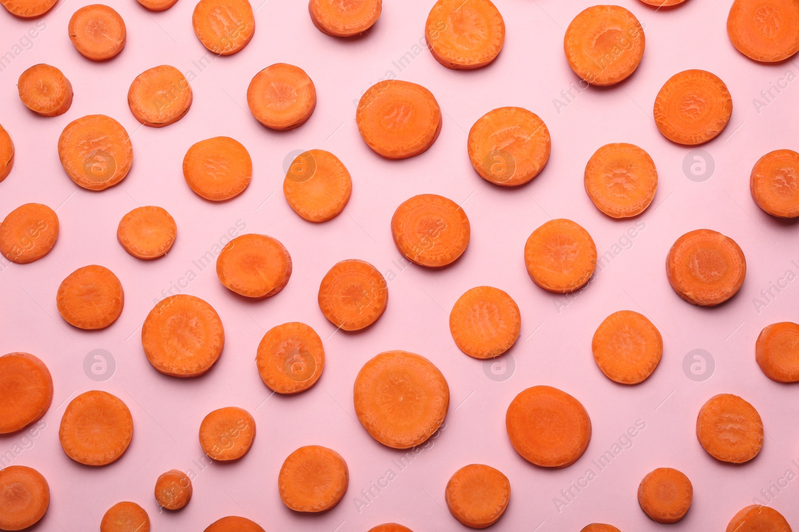 Photo of Flat lay composition with fresh carrot slices on color background