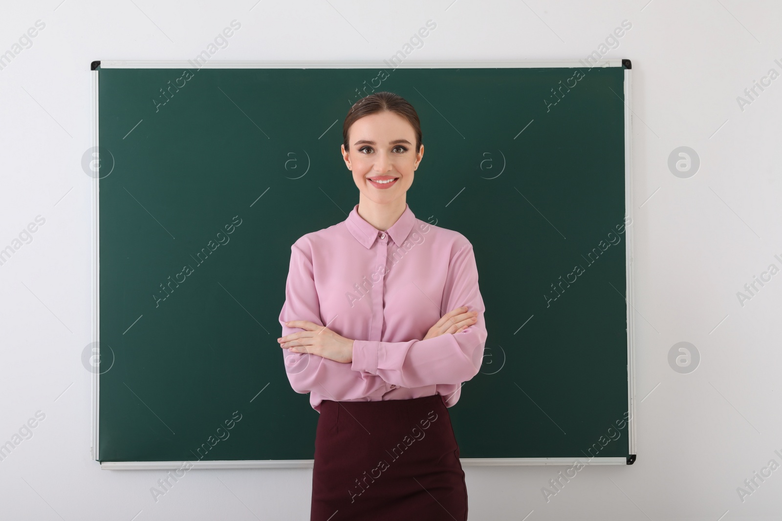 Photo of Portrait of young female teacher in classroom