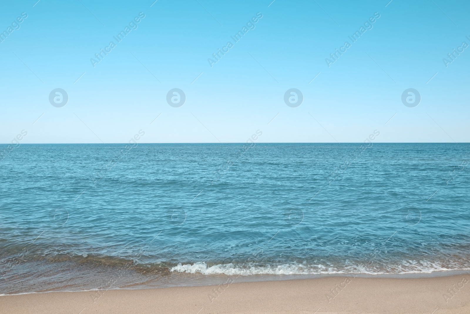 Photo of Picturesque view of sandy beach near sea