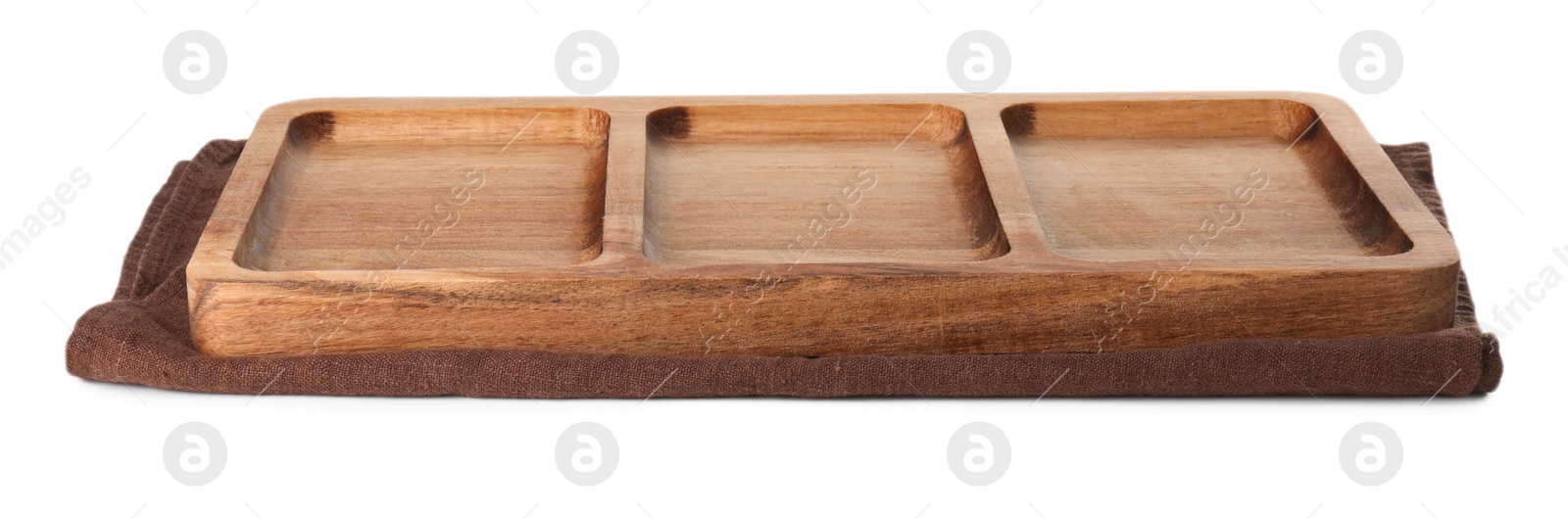 Photo of Wooden serving board and kitchen towel on white background