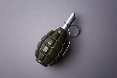 Photo of Hand grenade on grey background, top view