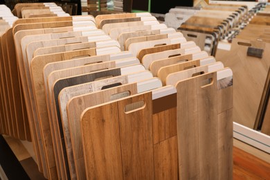 Many different samples of wooden flooring in store