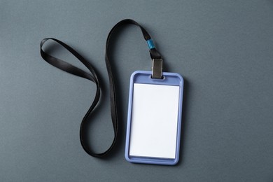 Photo of Blank badge with string on grey background, top view