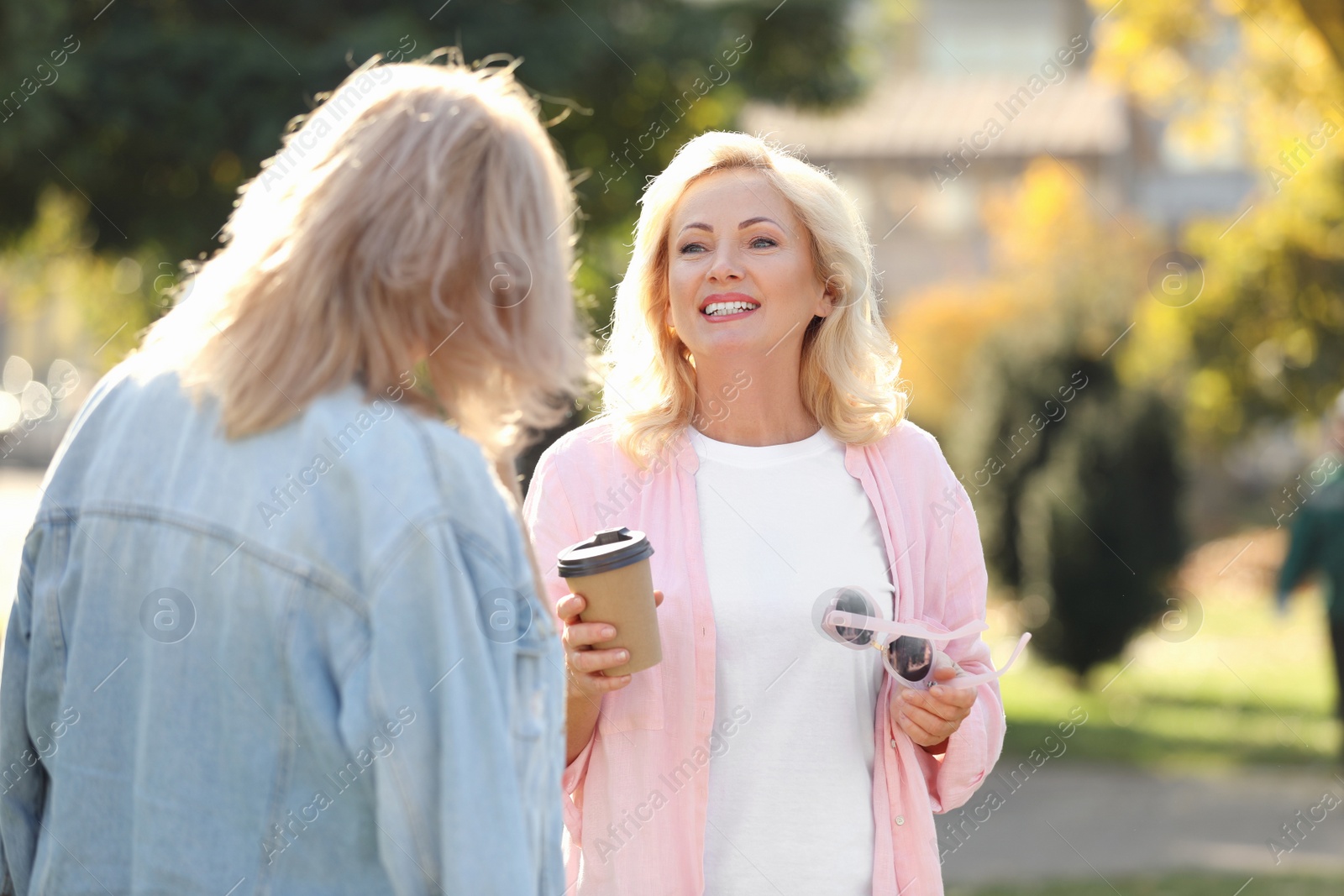 Photo of Happy mature women in park on sunny day