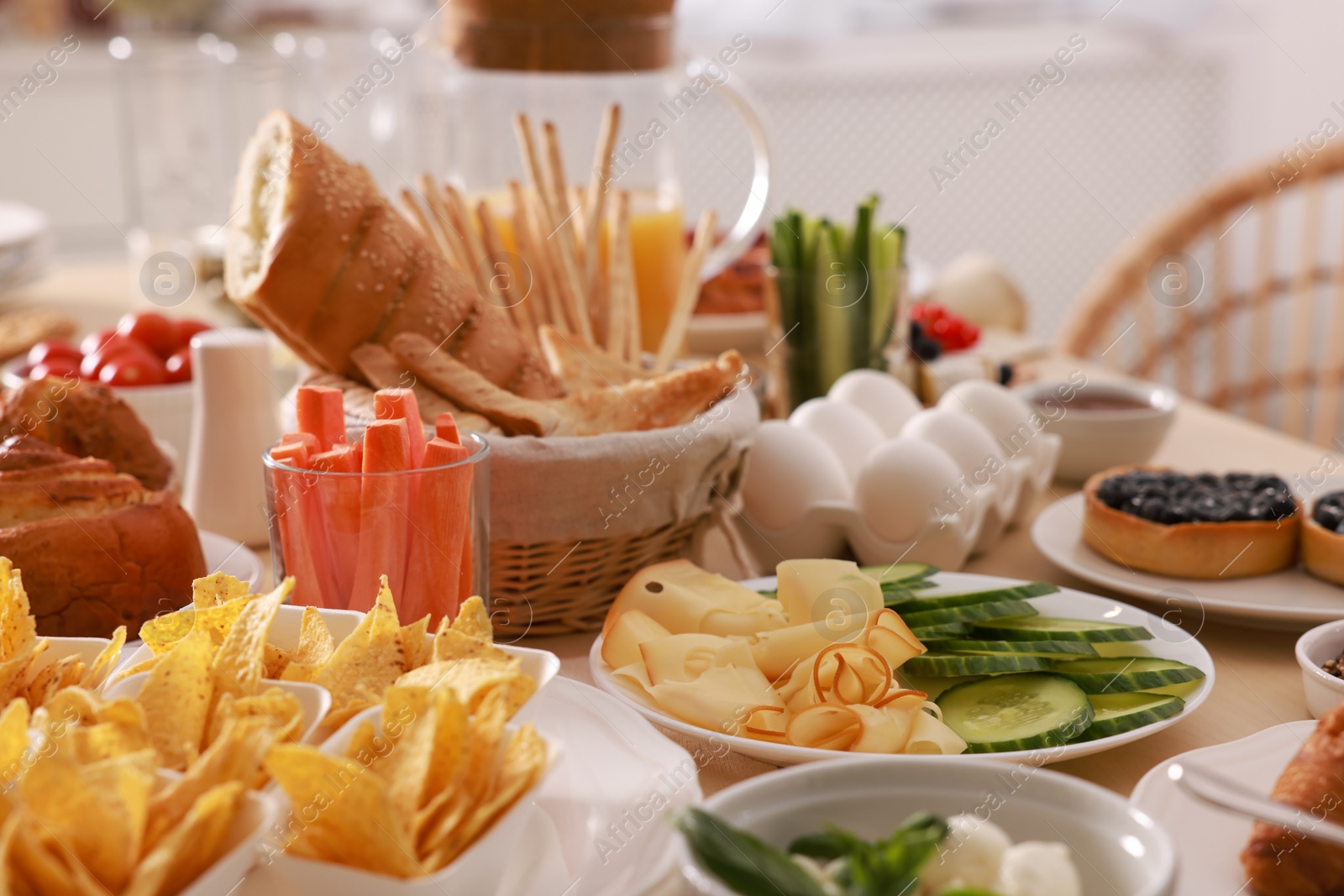 Photo of Dishes with different food on table in room. Luxury brunch