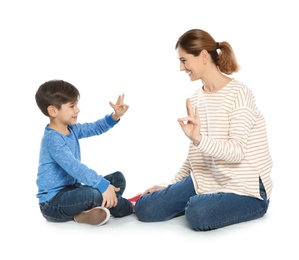 Hearing impaired mother and her child talking with help of sign language on white background