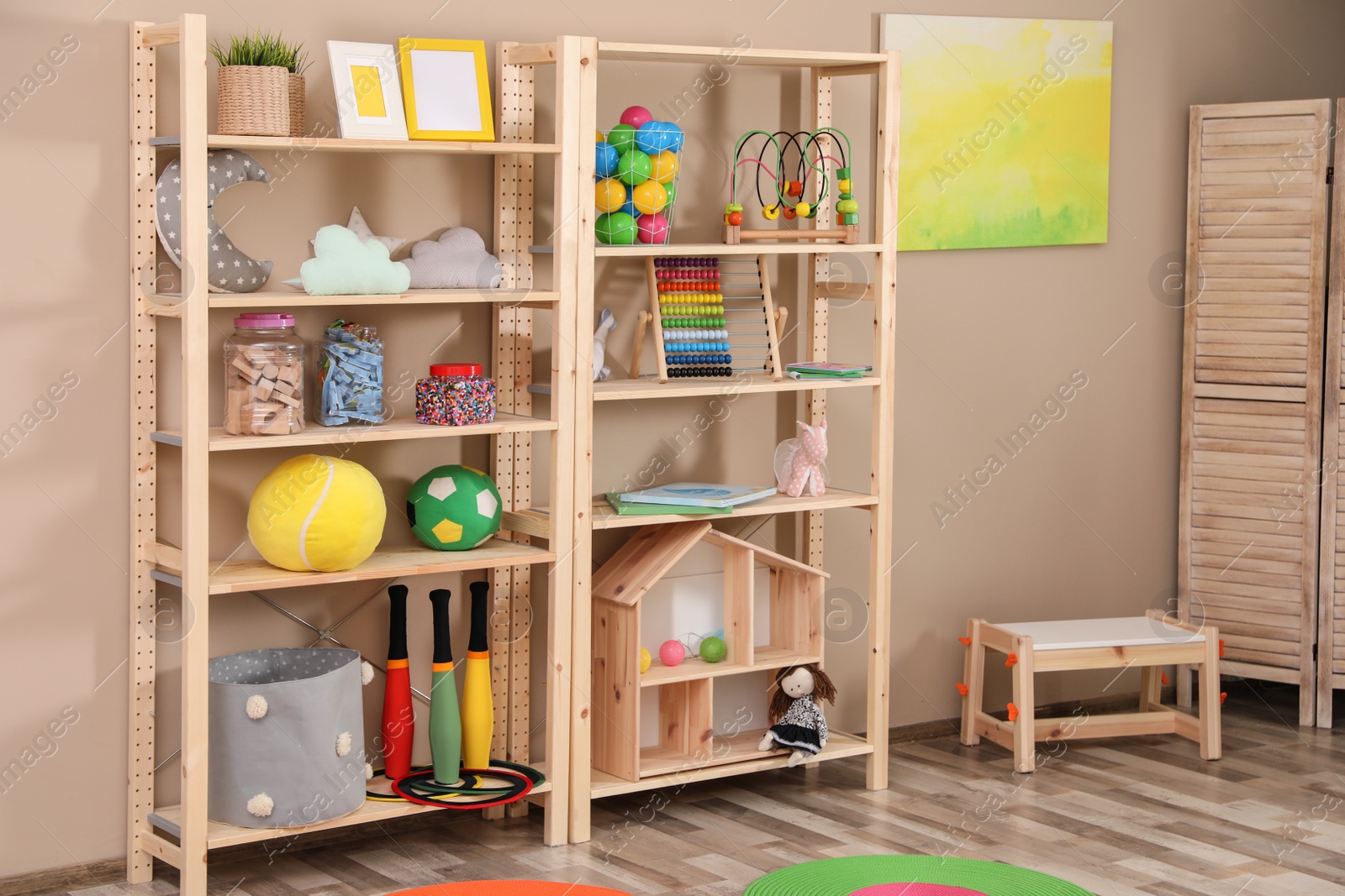 Photo of Storage for toys in colorful child's room. Idea for interior design