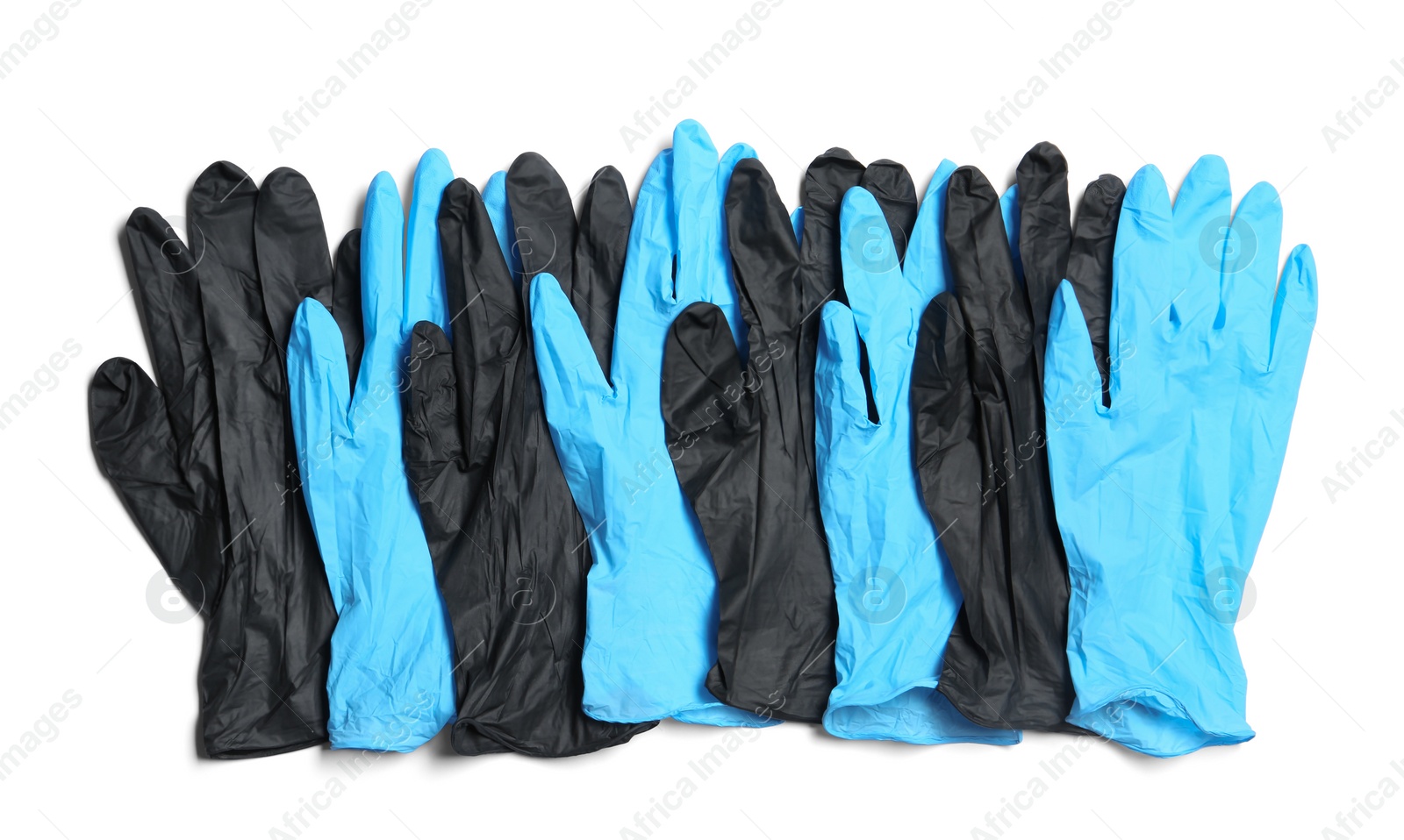 Photo of Different medical gloves on white background, top view