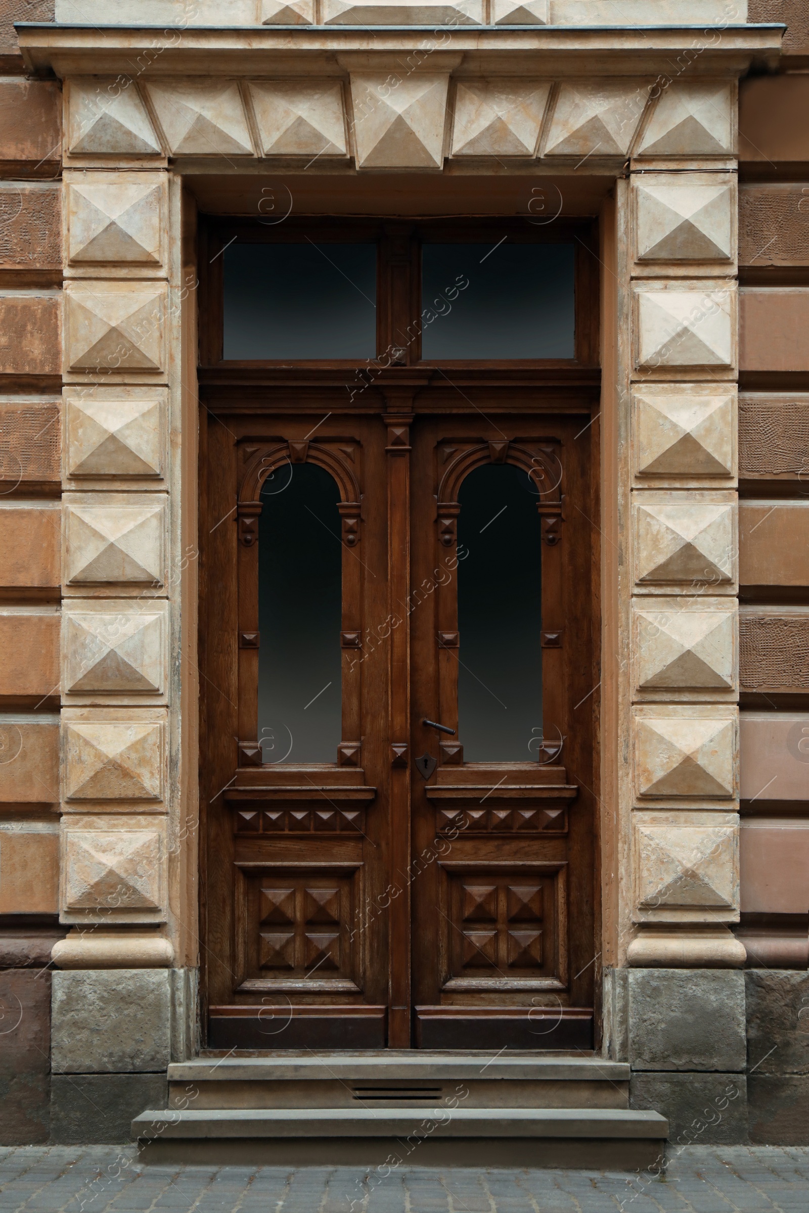 Photo of View of building with vintage wooden door. Exterior design