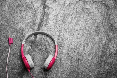 Photo of Stylish headphones on grey background, top view. Space for text