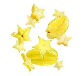 Tasty juicy carambolas flying on white background