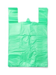 Photo of Stack of green plastic bags isolated on white, top view
