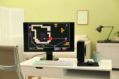 Photo of Modern computer and RGB keyboard on white table indoors