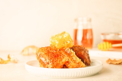 Image of Plate with fresh tasty honeycombs on table