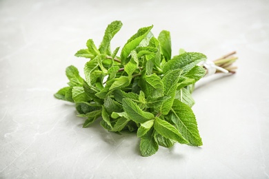 Bunch of fresh green mint on light background