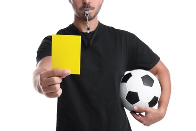 Photo of Football referee with ball holding yellow card on white background, closeup