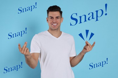 Image of Handsome man snapping fingers on light blue background