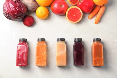 Flat lay composition with healthy detox smoothies and ingredients on light background