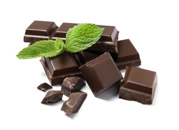 Pieces of dark chocolate with mint on white background