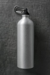 Photo of Aluminum sports water bottle on gray background