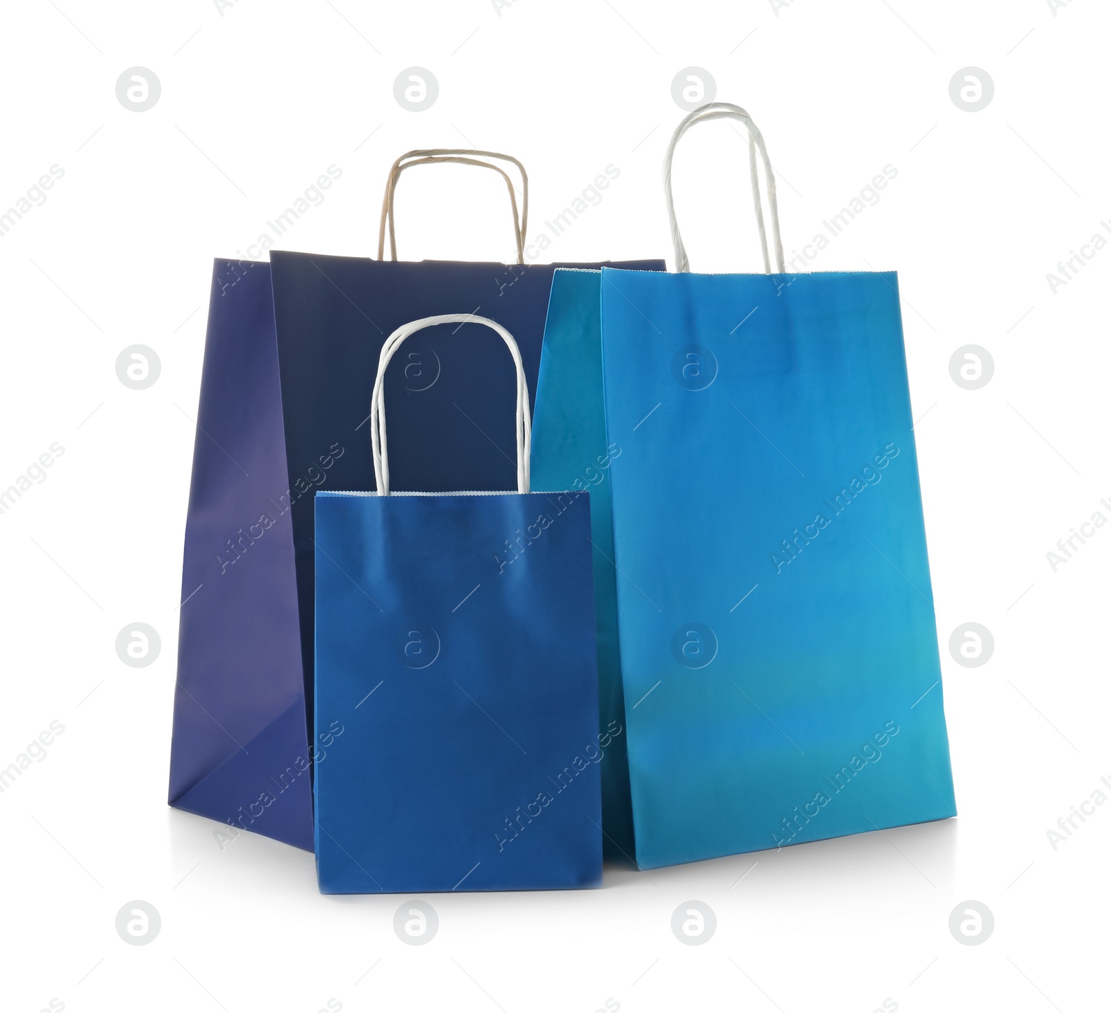 Photo of Mockup of paper shopping bags on white background