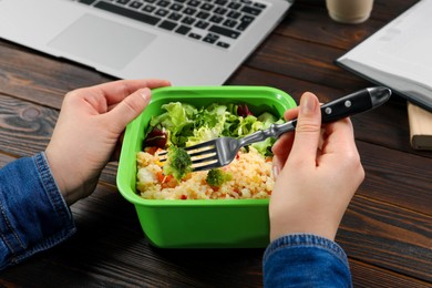 Office employee having business lunch at workplace, closeup