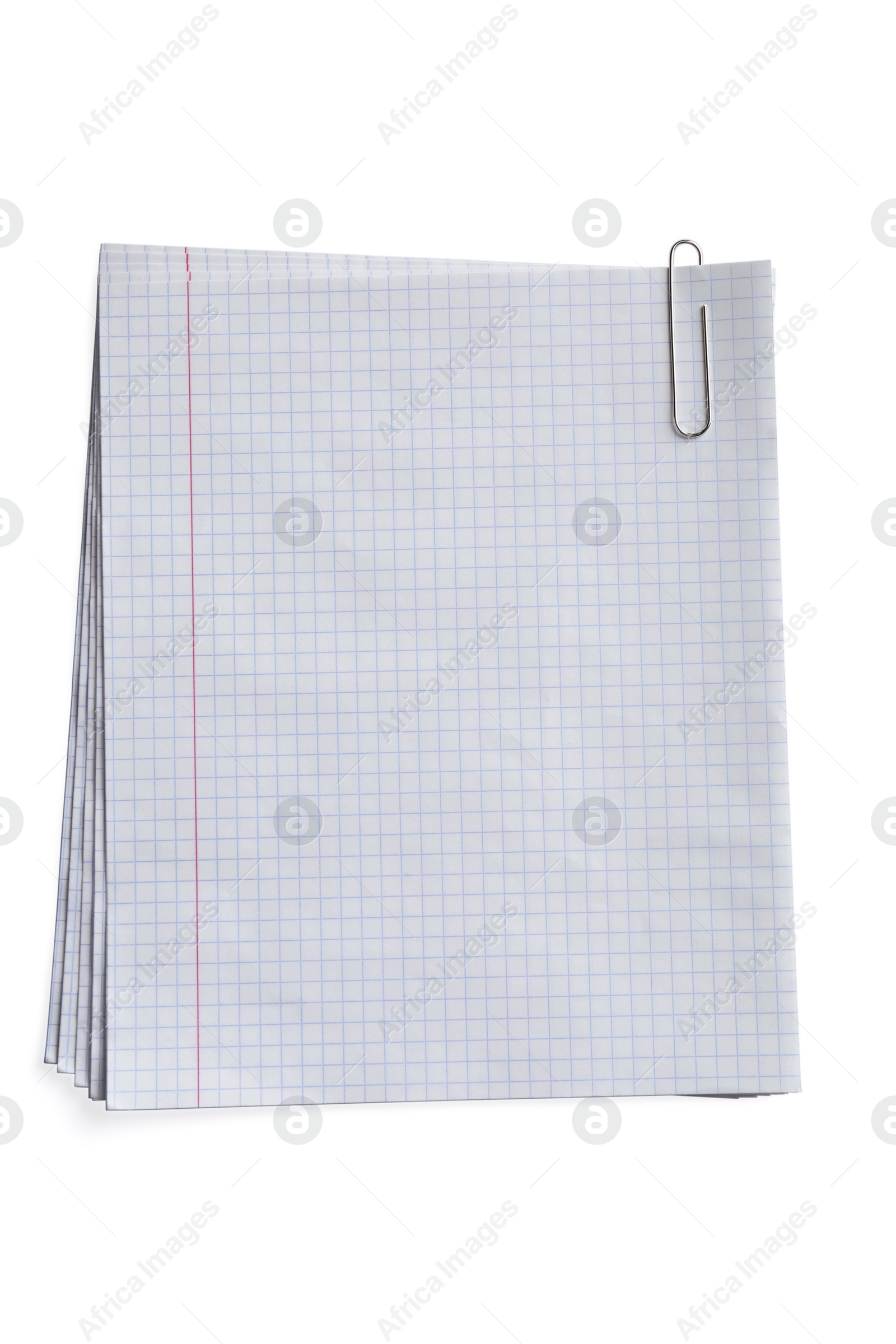 Photo of Stack of checkered paper sheets on white background, top view