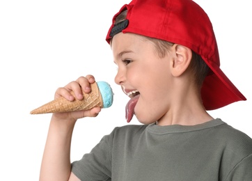 Adorable little boy with delicious ice cream on white background, closeup