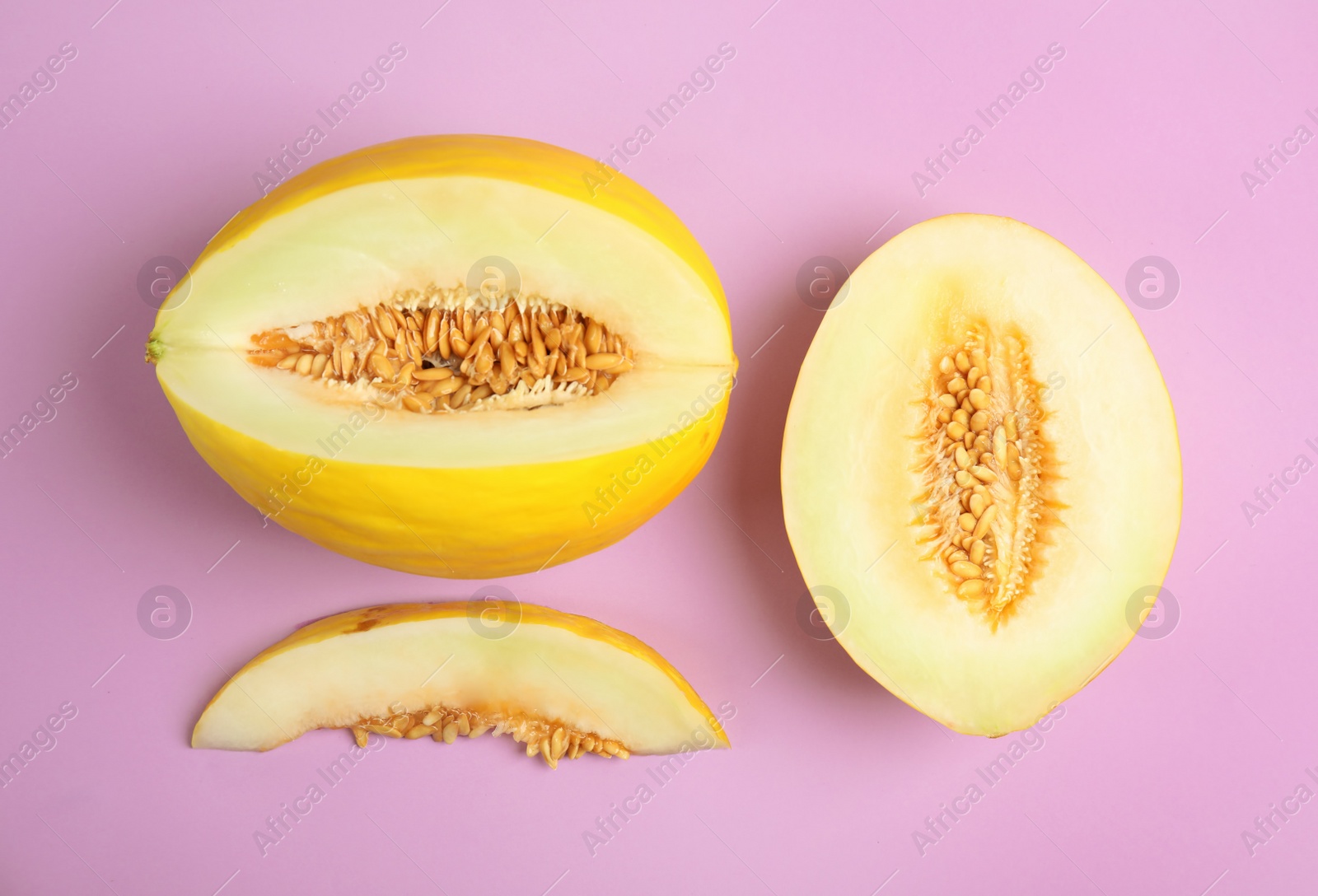 Photo of Flat lay composition with cut melon on color background