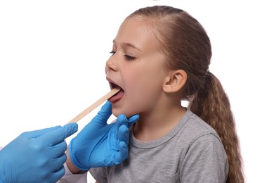 Photo of Doctor examining girl`s oral cavity with tongue depressor on white background