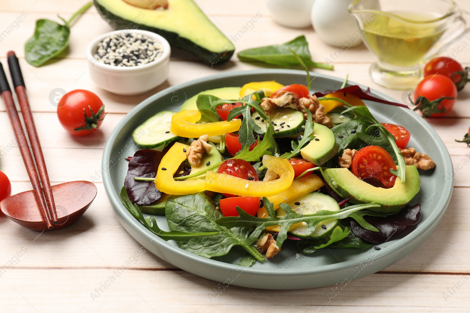 Photo of Balanced diet and vegetarian foods. Plate with different delicious products on wooden table