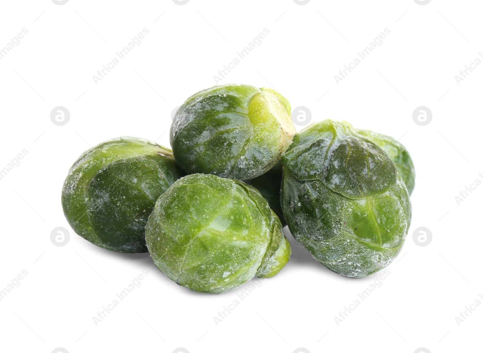 Photo of Pile of frozen Brussels sprouts isolated on white. Vegetable preservation