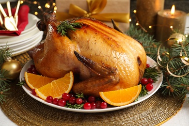 Delicious roasted turkey served for Christmas dinner on table