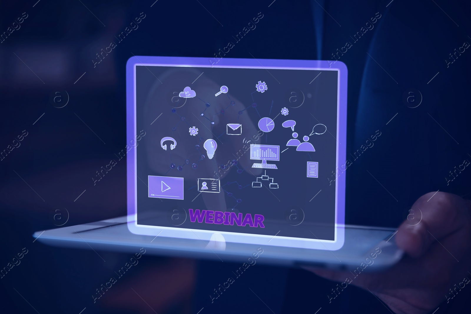 Image of Webinar. Man holding tablet, closeup. Virtual screen with icons over computer