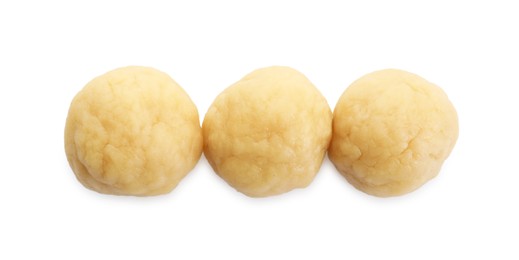 Photo of Making shortcrust pastry. Raw dough balls isolated on white, top view
