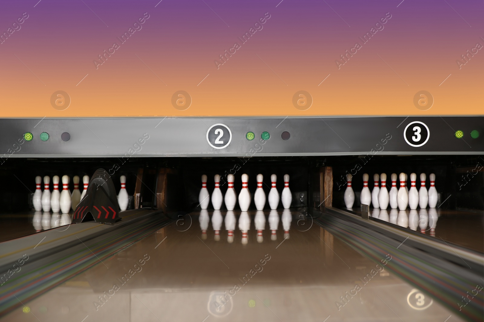 Photo of Bowling alley lanes with pins in club