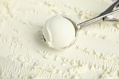 Scoop with delicious vanilla ice cream, closeup