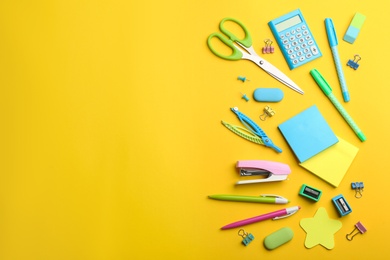 Photo of School stationery on yellow background, flat lay with space for text. Back to school