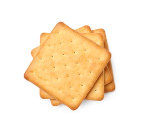 Photo of Many crispy crackers isolated on white, top view. Delicious snack
