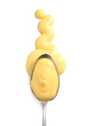 Photo of Delicious cheese sauce and spoon on white background, top view