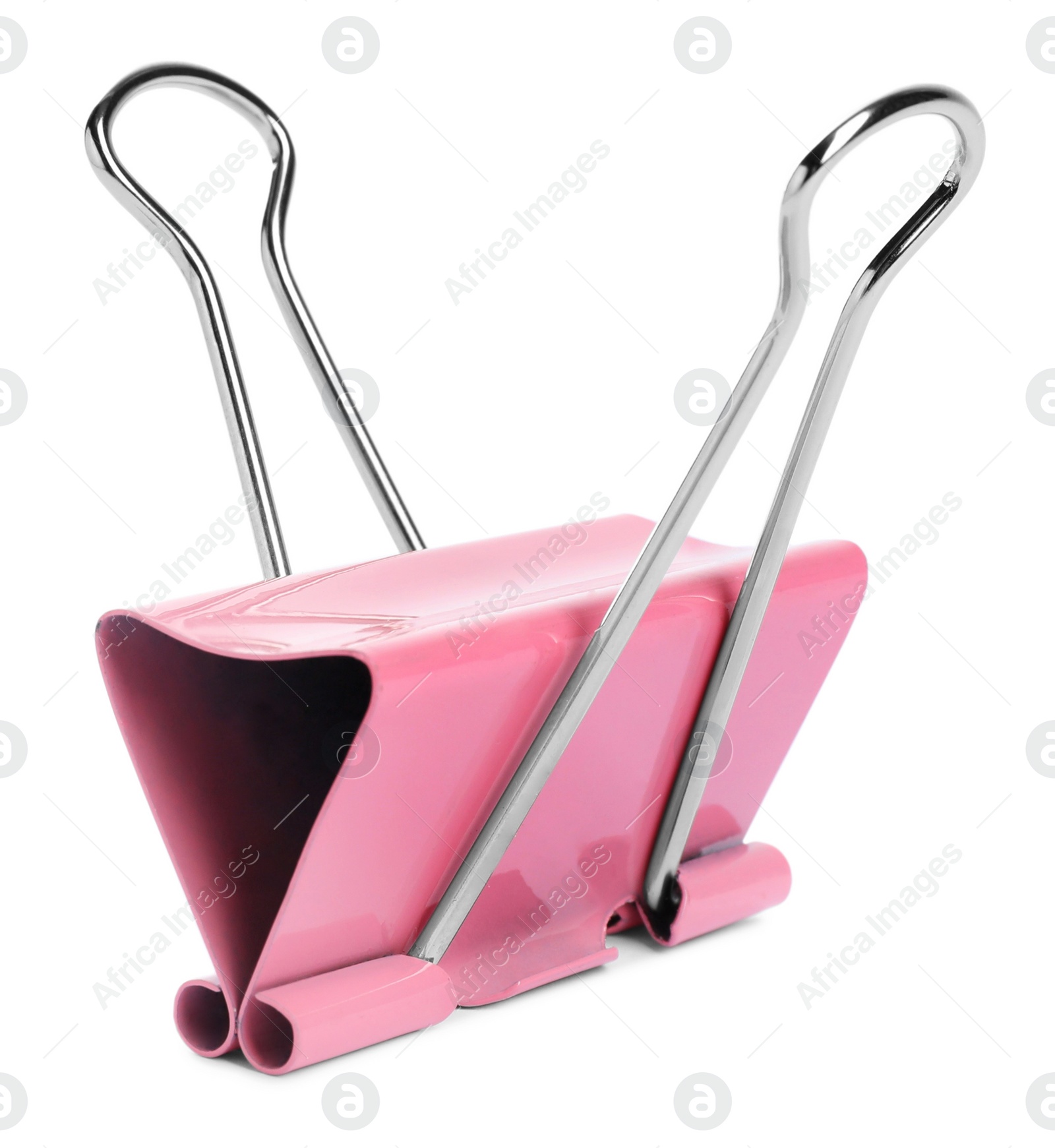 Photo of Pink binder clip isolated on white. Stationery item