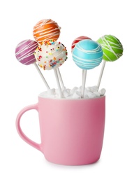 Photo of Delicious colorful cake pops in cup on white background