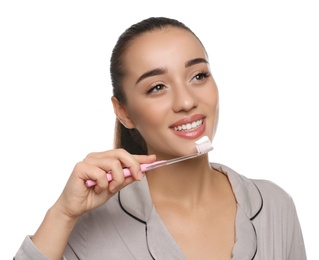 Photo of Woman holding toothbrush with paste on white background